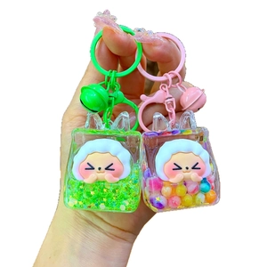Creative liquid sand keychain featuring a smiling cloud charm and colorful sequins in a clear bag