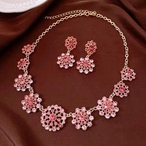 Vintage luxury jewelry set featuring pink rhinestone hollow circular necklace and earrings