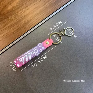 Portachiavi in acrilico sfumato rosa e viola con chiusura dorata e cinturino morbido