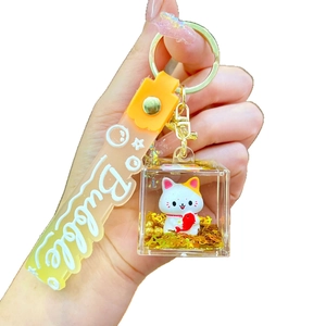 Cute lucky cat keychain with orange bubble strap and gold fish mascot in acrylic cube