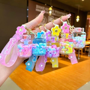 Creative Sakura snowflake quicksand keychain charm with liquid oil and flower pendant