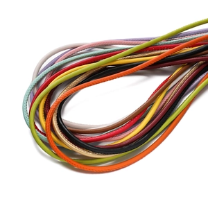 Macro shot of colorful braided 3/4/5mm PU leather cords with detailed stitching texture