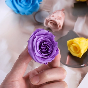 Close-up of colorful preserved rose heads showing delicate petal texture and vibrant hues