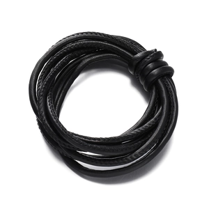 Close-up of black braided PU leather cord with high-quality texture and stitching details