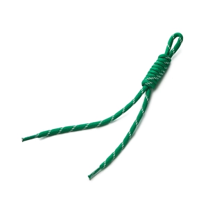 Macro detail of a green woven polyester cord with white accents and plastic aglets