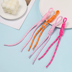 Close-up of colorful braided polyester cords with knotted loops for DIY accessories