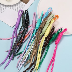 Close-up of colorful polyester braided cords with knotted loops for DIY hoodie drawstrings