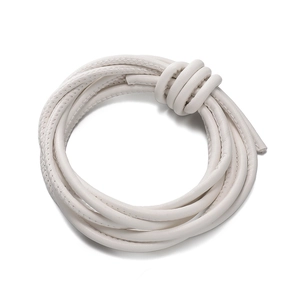 Macro detail of white woven PU leather cord with fine stitching for DIY bag straps