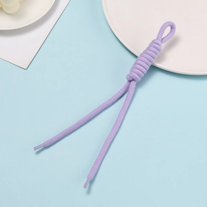 Detail of light purple handmade braided cord with plastic aglets for DIY accessories