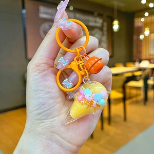 Creative orange ice cream keychain with colorful quicksand beads and a matching bell