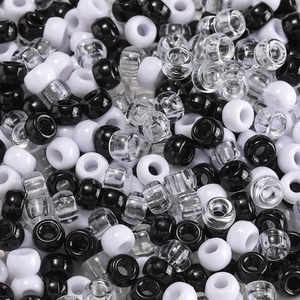 Detailed top view of black, white, and clear acrylic pony beads for DIY jewelry crafts