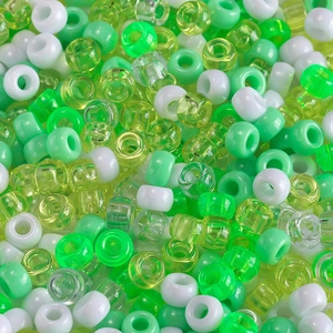 Macro shot of green and white large hole pony beads for DIY jewelry and hair crafts