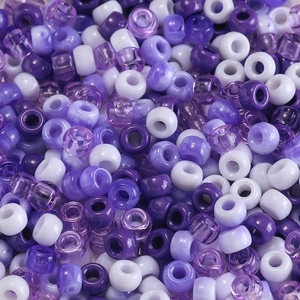 Macro detail of mixed purple and white acrylic pony beads with large holes for DIY crafts