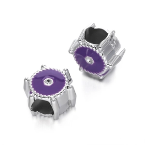 Close-up of silver-tone CCB beads with purple enamel detail for DIY jewelry making