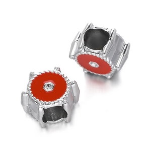 Detailed view of CCB red enamel star and bear paw spacer beads for DIY jewelry making