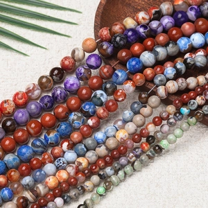 Close-up of polished 8-10mm colorful natural stone beads with diverse textures