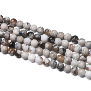 Macro detail of natural striped agate beads showing colorful patterns and wax luster