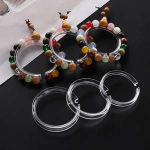 Clear acrylic bracelet display ring holder showing transparent jewelry stand detail