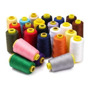 Close-up of multicolor 402 polyester sewing thread spools for high-speed machines