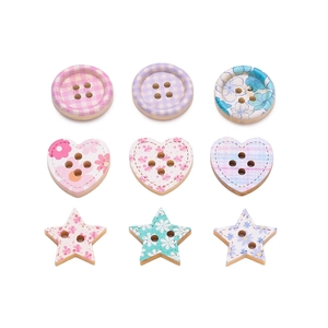 Macro shot of 9 colorful floral wooden buttons in round, heart, and star shapes