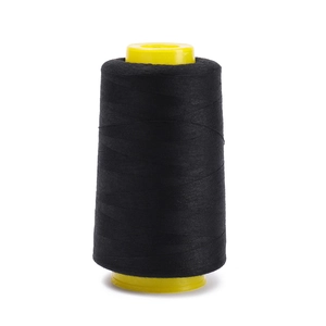 Close-up of black 402 polyester sewing thread wound on a yellow plastic cone spool