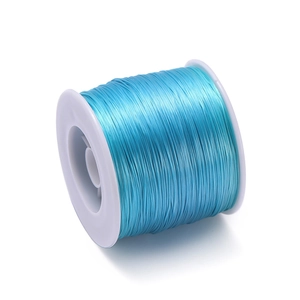 Detailed view of 0.8mm light blue elastic TPU bead cord wound on a white plastic spool