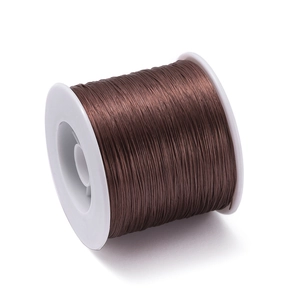 Macro shot of 0.8mm brown elastic cord on a white spool for DIY jewelry beading