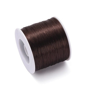 Detail of 0.8mm dark brown elastic TPU thread neatly wound on a white plastic spool