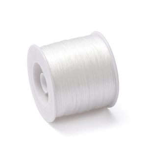 Close-up of 0.8mm clear elastic TPU thread wound on a white spool for DIY jewelry making