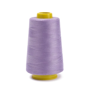 Close-up of lavender 402 polyester sewing thread wound on a yellow plastic cone