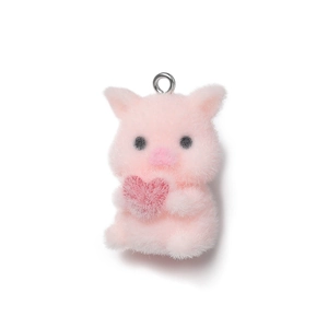 Detail of pink flocked pig pendant with heart, soft texture and silver metal ring loop