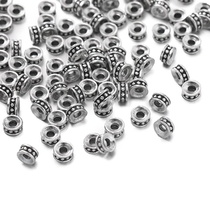Cuentas espaciadoras planas de aleación de zinc plata antigua con relieve para joyas DIY