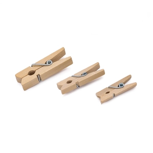 Detailed view of three sizes of natural wooden clips with durable metal springs