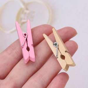 Mini pink and natural wooden photo clips for DIY home decor and wall display hanging