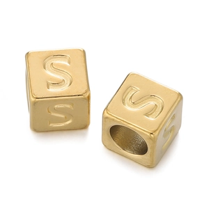 Detailed macro view of a 7mm golden stainless steel cube bead with engraved letter S