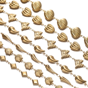 Detail of gold stainless steel craft chains with shell, butterfly, and heart charms