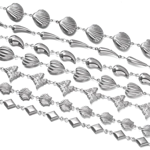 Detail of stainless steel DIY chains with shell, butterfly, and teardrop pendant charms