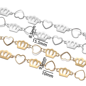 Detailed macro view of stainless steel heart and crown chain links with measurements