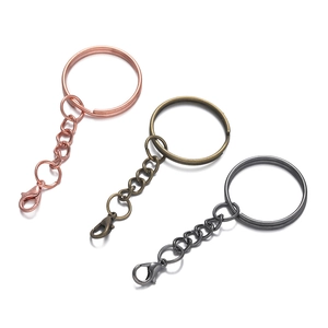 Detail of keychain rings with lobster clasps in rose gold, bronze, and gunmetal plating