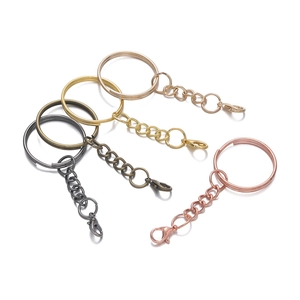 Detail of 25mm keychains with lobster clasps in black, bronze, gold and rose gold colors