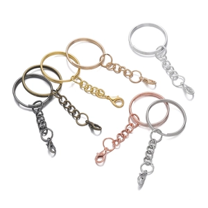 Detail view of colorful lobster clasp keychain rings in silver, gold, and bronze finishes
