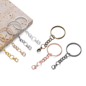 Assorted 25mm flat metal key rings with lobster clasps for DIY jewelry making crafts.