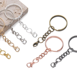 Detailed close-up of 25mm metal keychain rings and lobster clasps in five plating colors