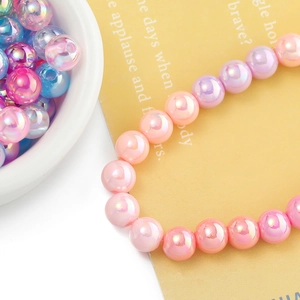 Macro detail of iridescent mermaid acrylic beads for DIY jewelry and phone charms