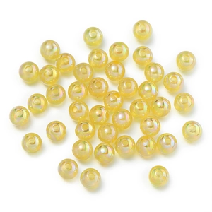 Macro shot of light yellow AB iridescent acrylic round beads for DIY jewelry making