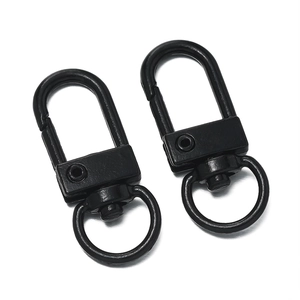 Detailed macro view of black painted 32mm metal lobster clasps with 360-degree swivel rings