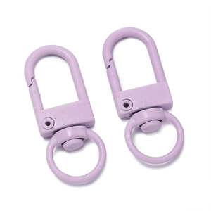 Detail view of two purple matte lacquered 32mm alloy spring gate snap hooks with swivels