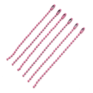 Detailed view of pink metal ball chains with secure connector clasps for DIY jewelry