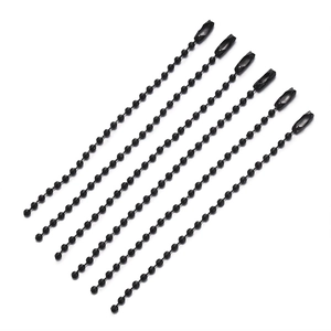 Detail of 7 shiny black ball chains with matching connectors for DIY keychains and tags