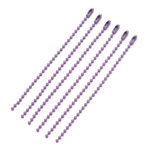 Macro view of purple metal ball chains with connectors for DIY keychains and labels